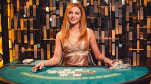 Mobile phone showing wdyuk login Qiu Qiu table interface with live dealer video feed and betting controls